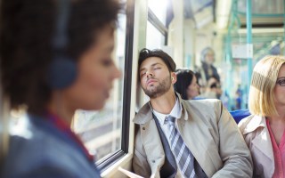 man sleeping on bus