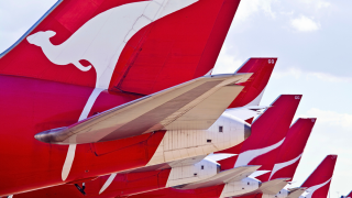 Qantas planes lined up on the tarmac flight credits