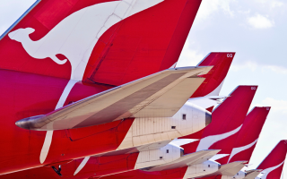 Qantas planes lined up on the tarmac flight credits