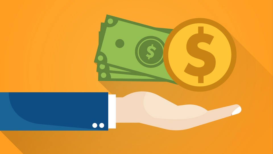 Money being handed over to an anonymous person in a suit.