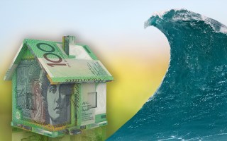 A house made of money about to be wiped out by a huge wave.