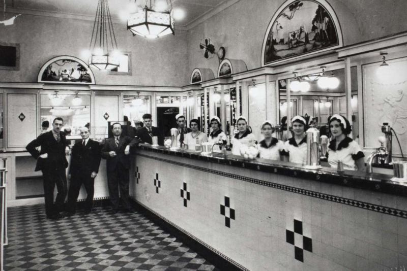 Black and white photo of Australia's first milk bar in Sydney.