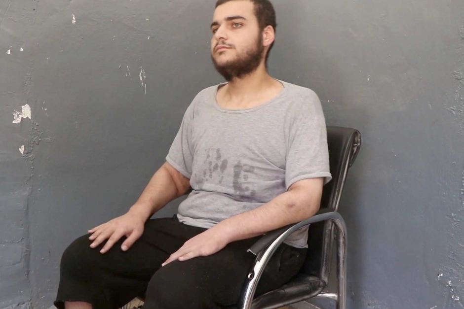 Hamza Elbaf sitting in a chair.