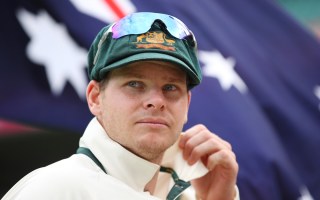 Steve Smith in front of the Australian flag.