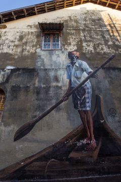 GEORGETOWN, PENANG, MALAYSIA - 2016/02/16: George Town Penang Street Art is composed on crumbling old walls in the old parts of the city.  Most of the more artistic murals and street art were created by a Lithuanian artist Ernest Zacharevic who  lived in Penang for a few years.  His artworks are humorous but at the same time open to interpretation.  Besides the paintings and murals, there are also steel rod wire sculptures scattered around the old sections of George Town with more local and somewhat less artistic themes. (Photo by John S Lander/LightRocket via Getty Images)