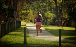 A woman runs along a track in Brisbane