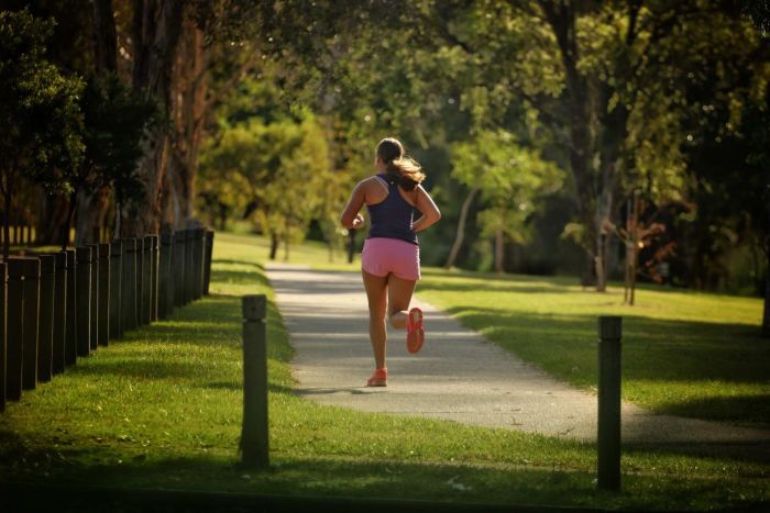 A woman runs along a track in Brisbane