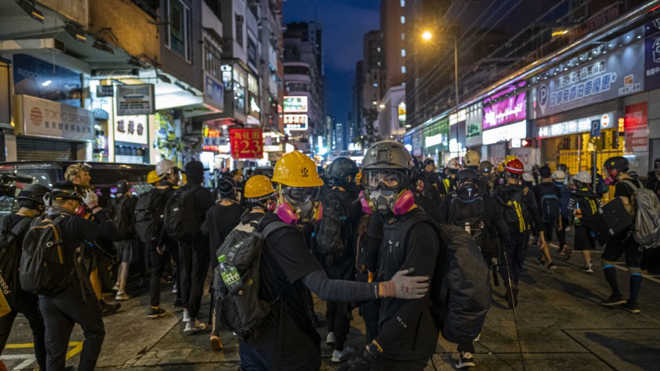Protesters outside the Mong Kok police station in Hong Kong, Aug. 17, 2019. China is moving to impose new national security laws that would give the Communist Party more authority in Hong Kong, a proposal announced on May 21, 2020. (Lam Yik Fei/The New York Times)