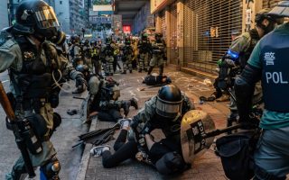 Police restrain protesters in Hong Kong