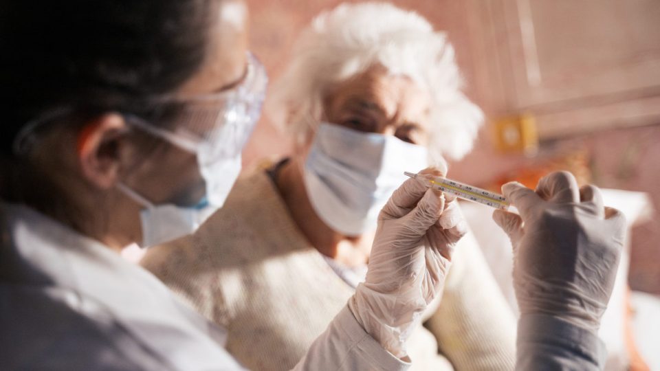 doctor doing medical exam to a senior woman