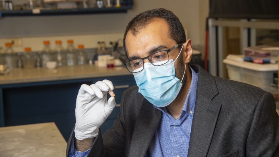 Dr Rahim Rahimi with the capsule