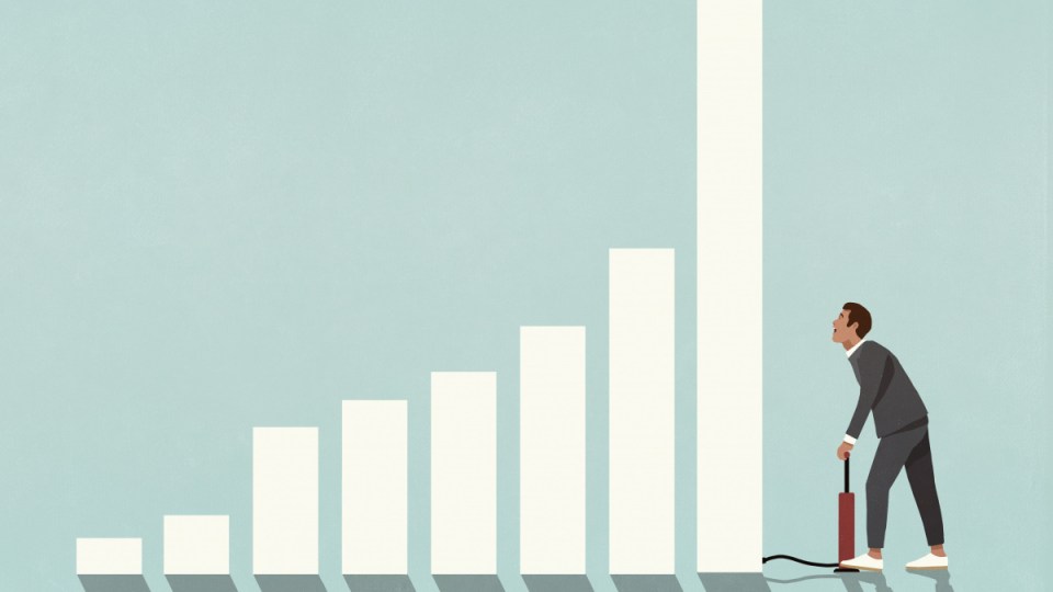 investing businessman inflating bar graph