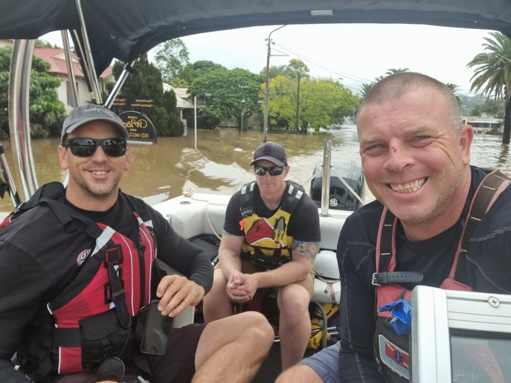 Phil Benfield (right) says he rescued around 100 people during the recent floods in Lismore.