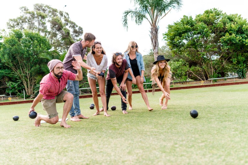 Pictured is people playing barefoot bowls