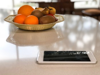 Pictured is a phone on the kitchen bench.