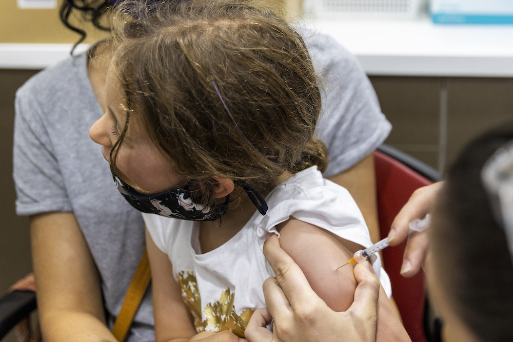 Pictured is a child getting vaccinated