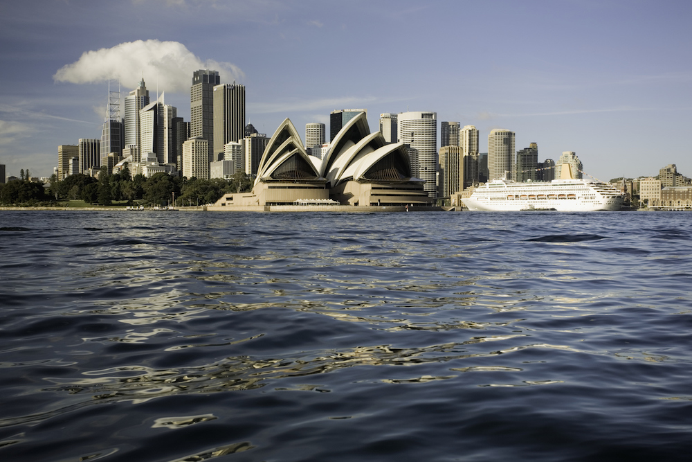 View of Sydney, Opera House, Circular Quay and Sydney Cove from small boat. Sydney, Australia
