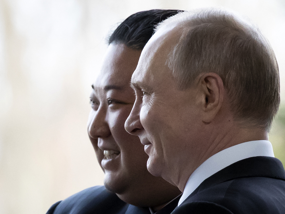 Russian President Vladimir Putin welcomes North Korean leader Kim Jong Un prior to their talks at the Far Eastern Federal University campus on Russky island in the far-eastern Russian port of Vladivostok on April 25, 2019. 