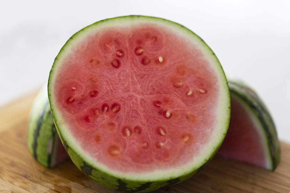 A small watermelon cut in half
