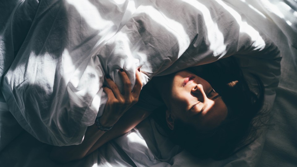 pictured is someone sleeping, to show the change to Daylight Saving Time